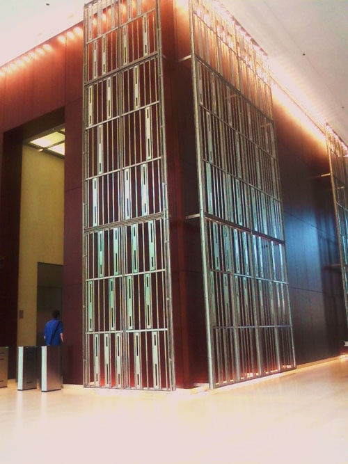 Completed Laser Cut Stainless Steel Decorative Screen Wall in a Building Lobby